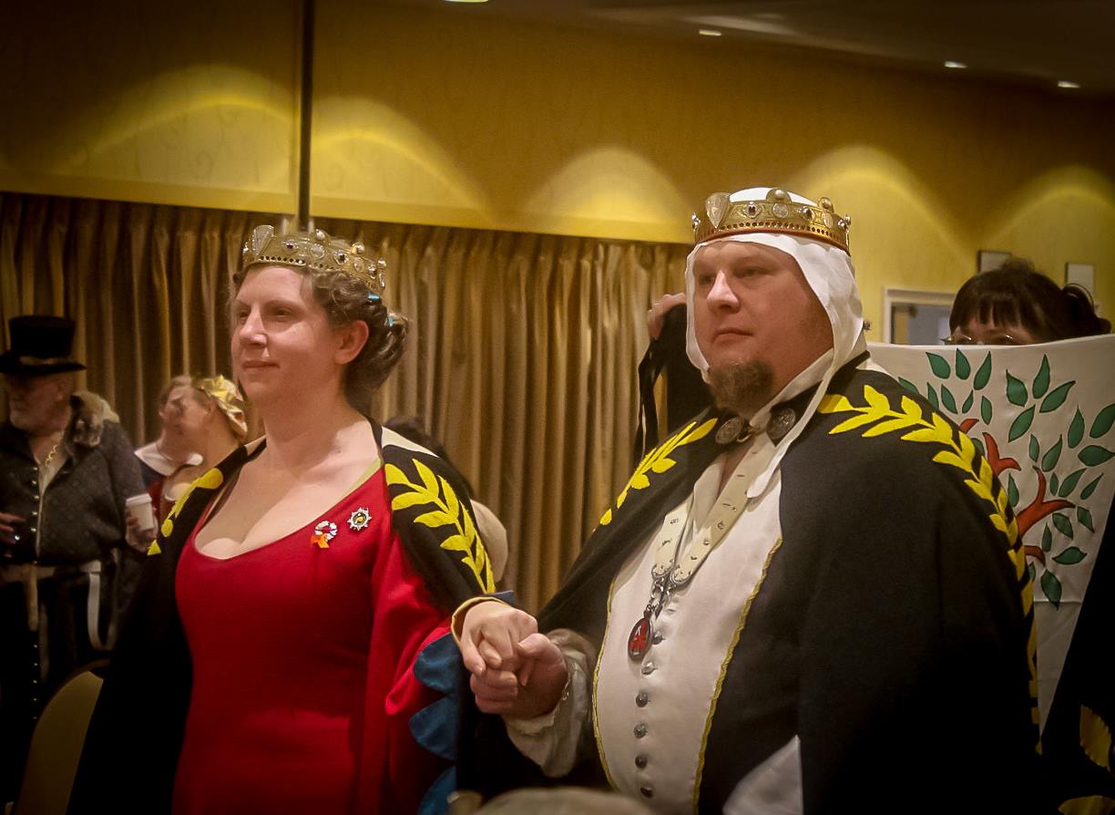 Spike and Enzio, the Baroness and Baron of Madrone process into court at the Kingdom Arts and Sciences Championships in An Tir