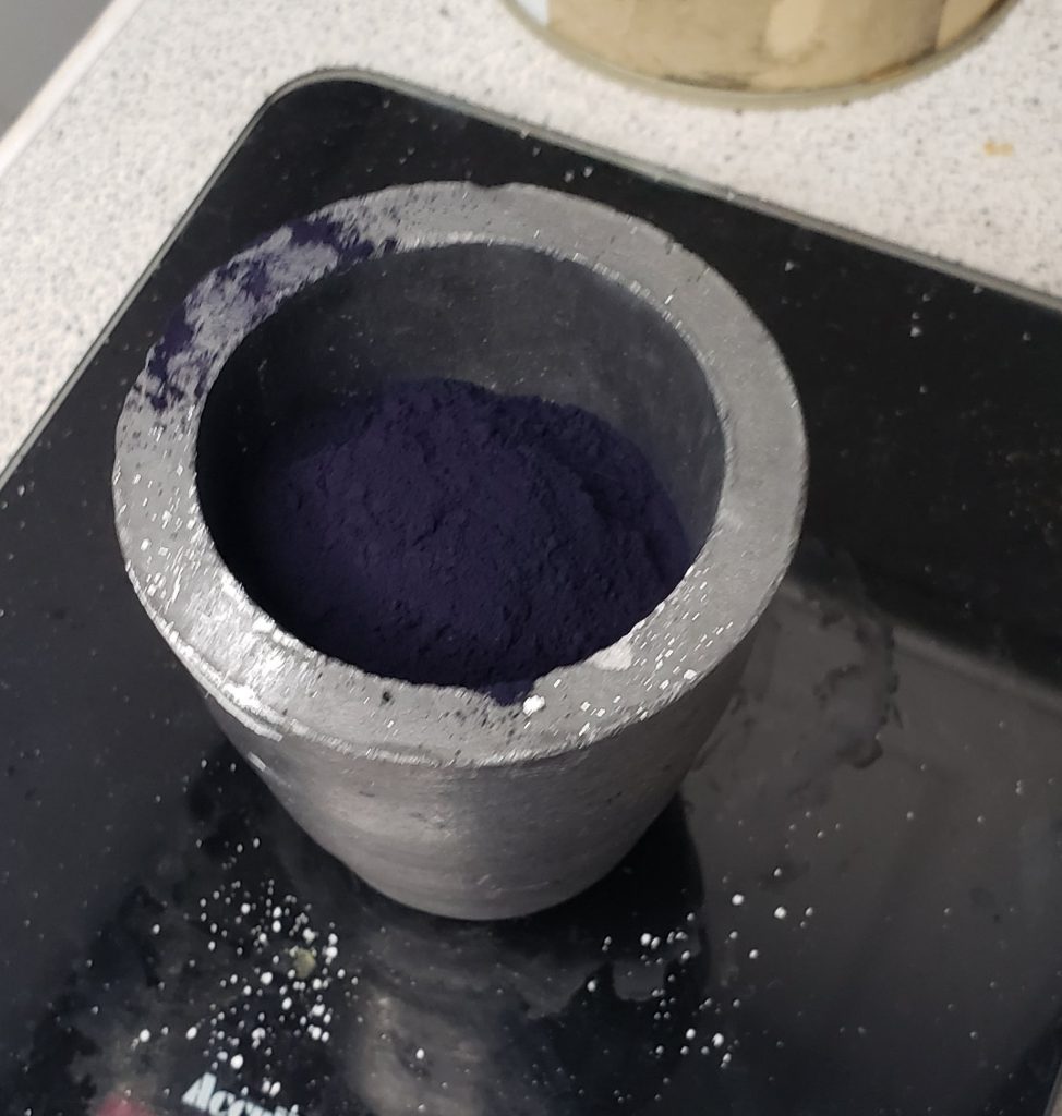 Small clay crucible with indigo