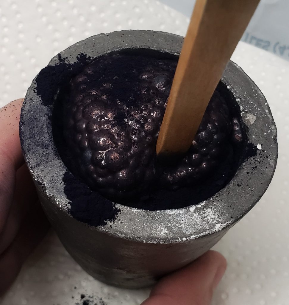 Mixing indigo, lead, and vinegar in small clay crucible