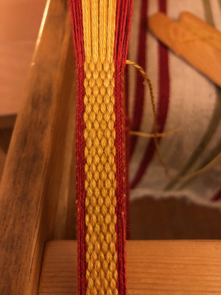 red and gold tablet woven band