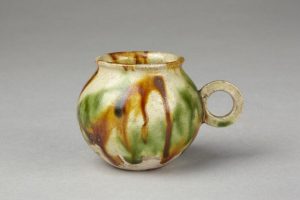 Cup, part of a wine set. Earthenware with coloured lead glazes