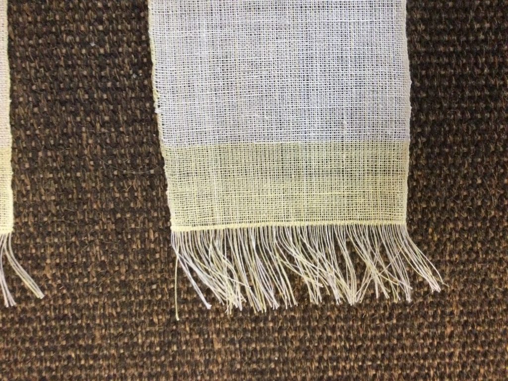 weaving showing the hemming of one end