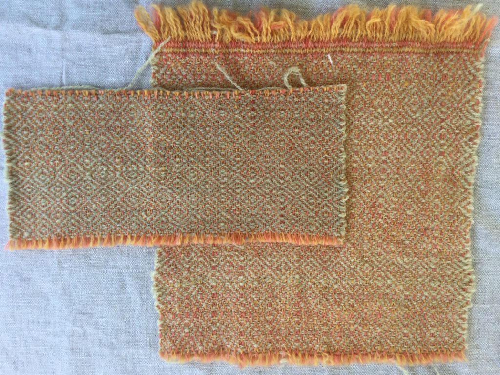 a washed sample of woven cloth sits partly overtop an unwashed sample of the same cloth.