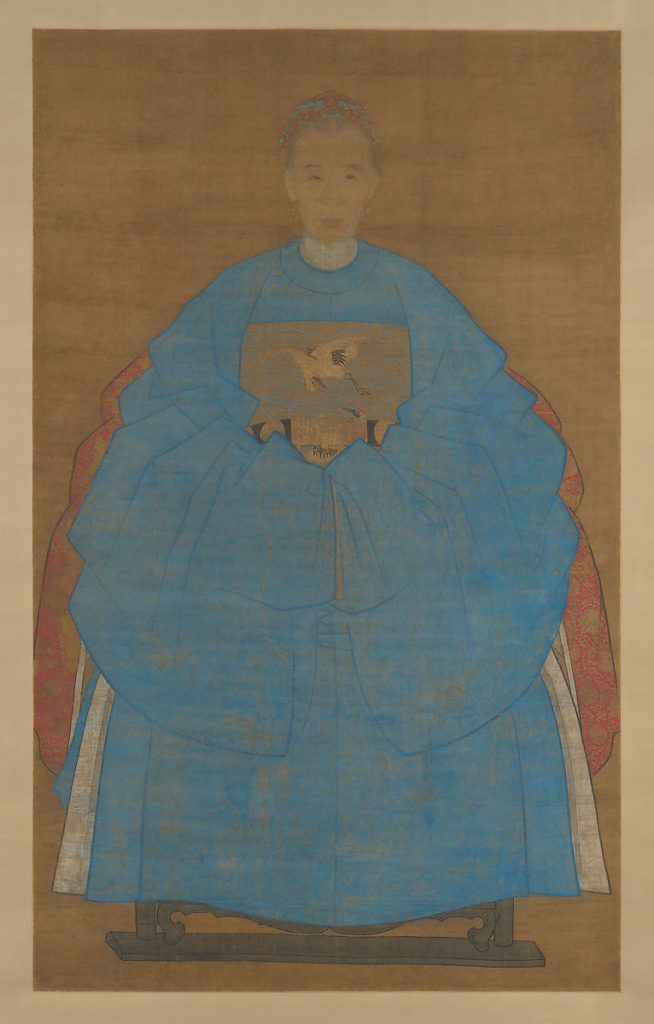 Chinese portrait of a woman seated in a blue robe with a collar and a button at the neck and shoulder