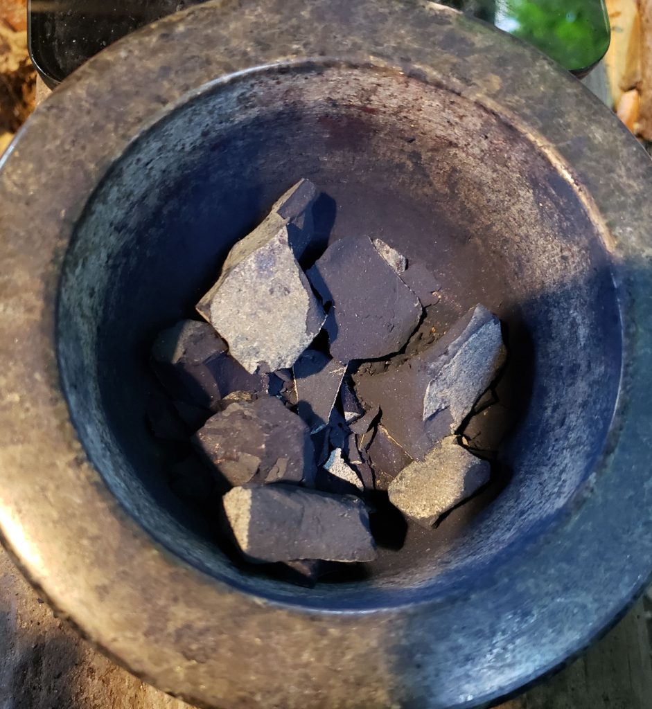 Mortar and pestle with large indigo chunks