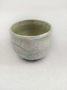 Raku glazed bowl with ink side view