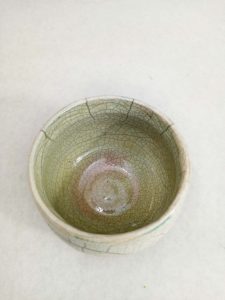 Raku glazed bowl with ink top view